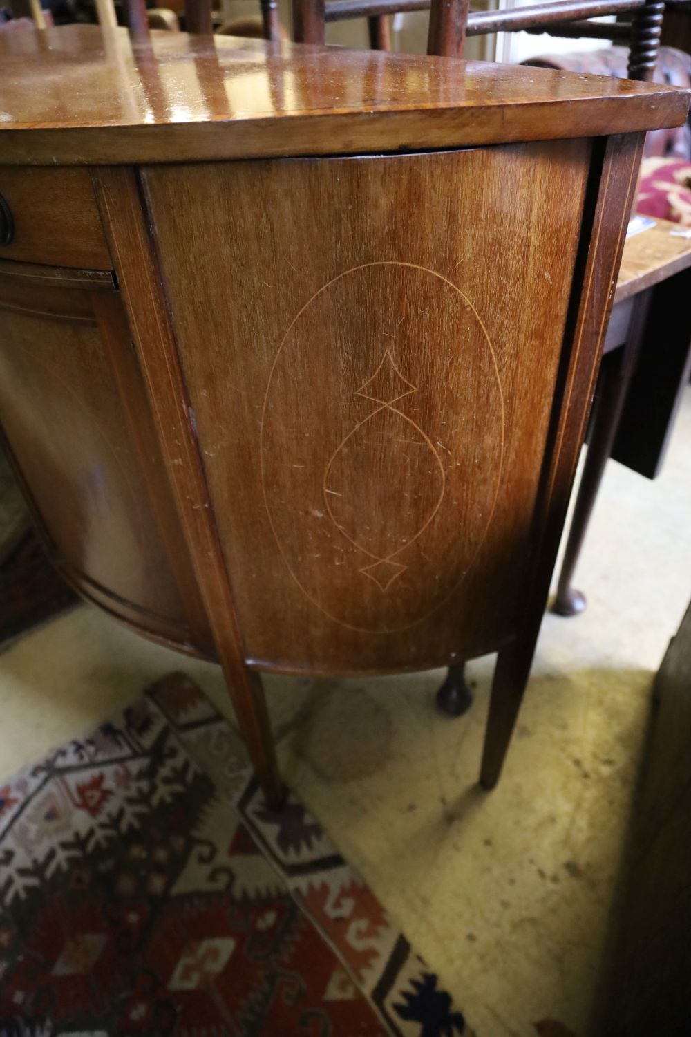 A Sheraton revival mahogany demi lune cabinet, width 95cm, depth 42cm, height 94cm